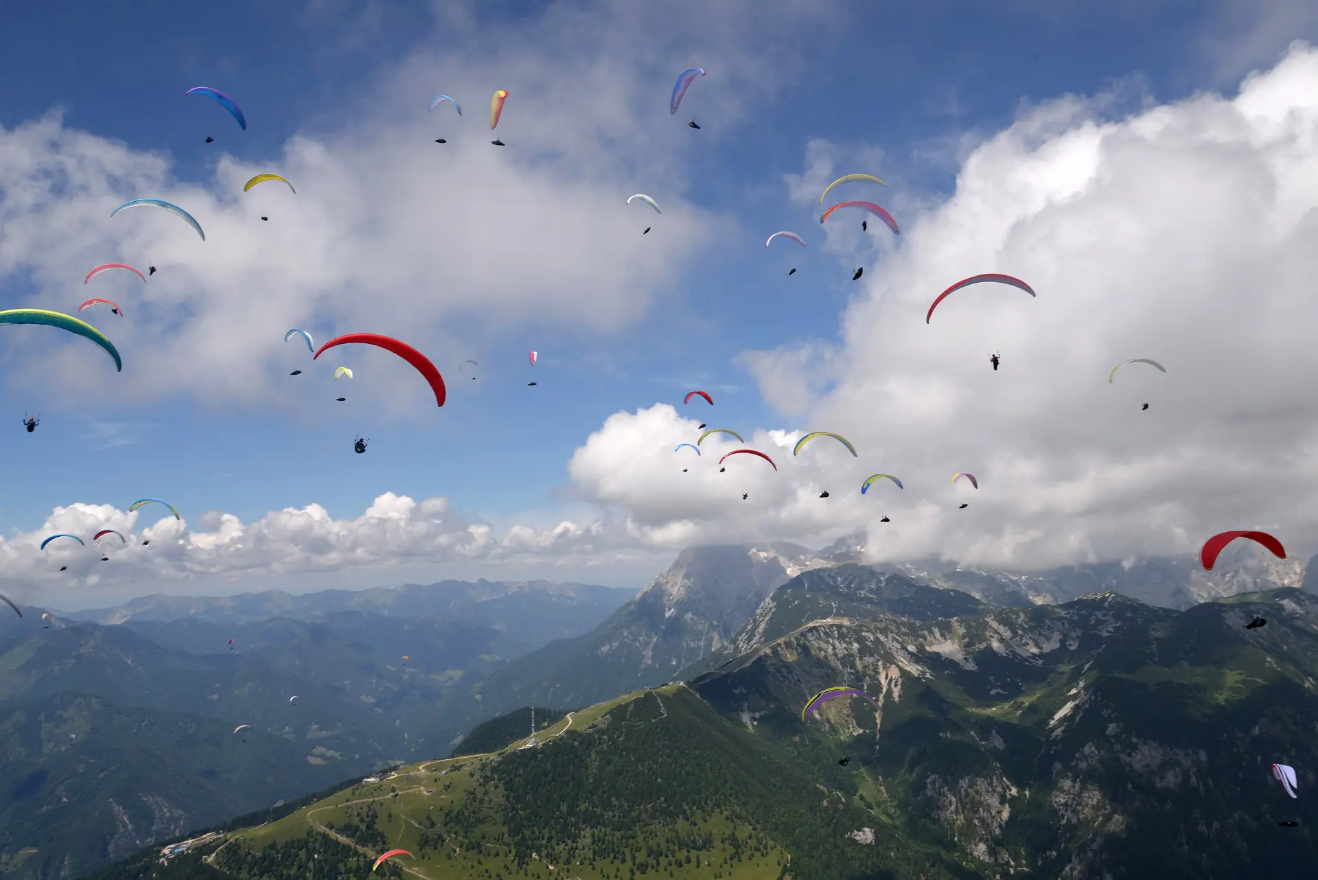 Paragliders above the Julian Alps