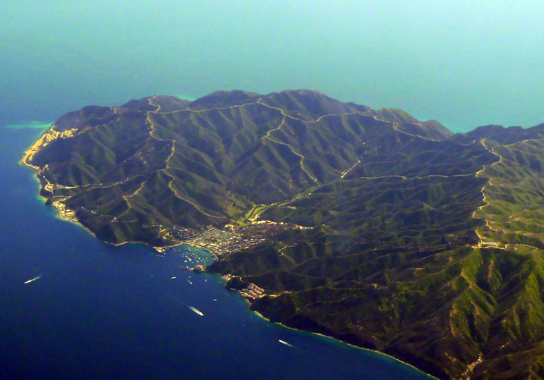 Avalon on Catalina Island from the air, the harbour and the hills behind