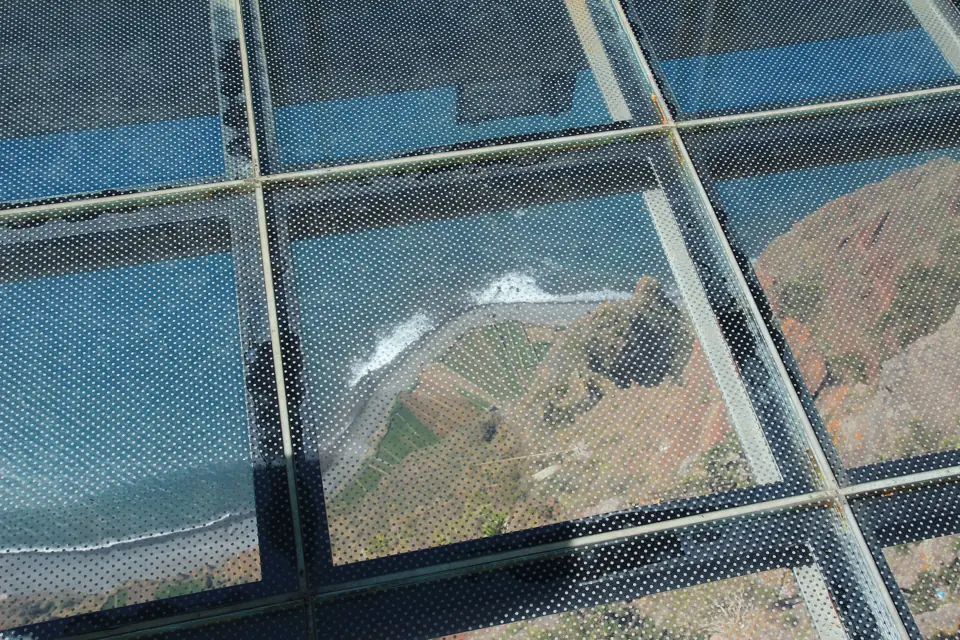 Glass platform of the Cabo Girão skywalk high above the coast