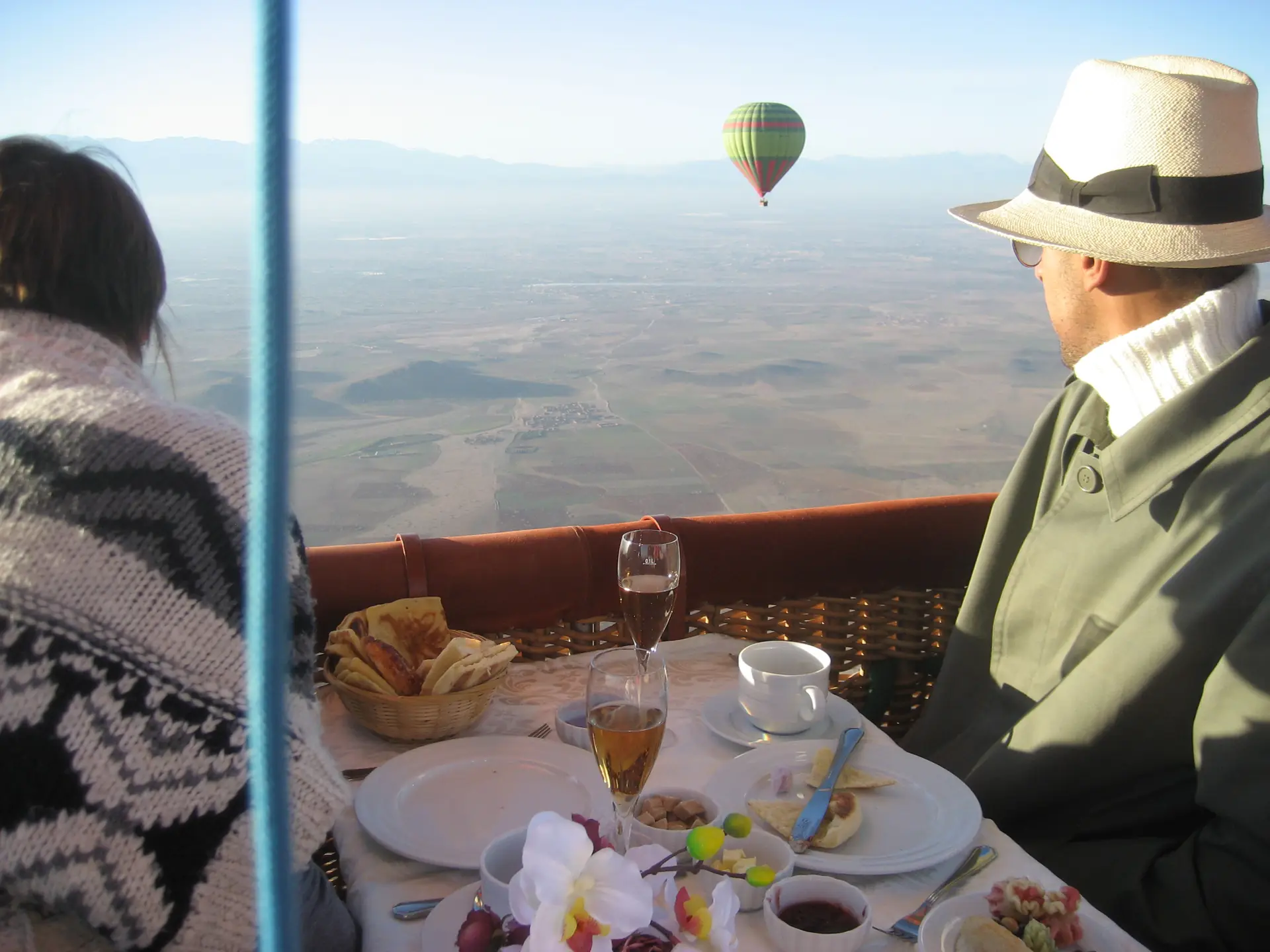 A hot-air balloon of Ciel d'Afrique in flight over the plains near Marrakech