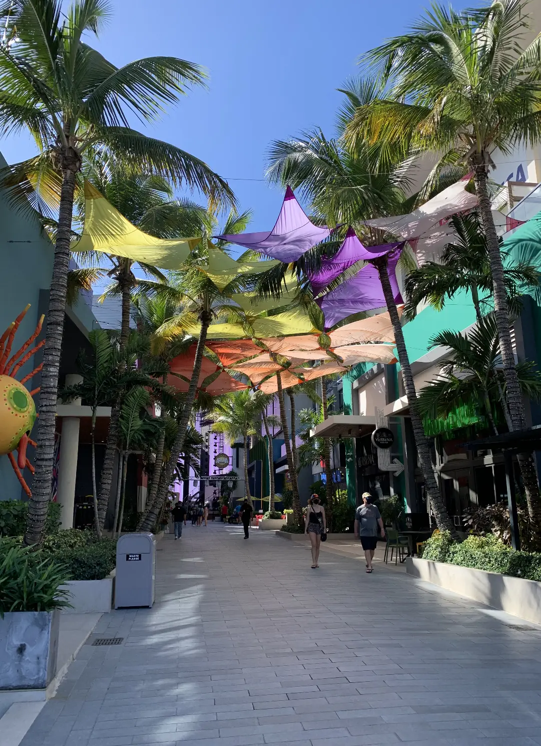 The Distrito T-Mobile entertainment district in San Juan with palms and coloured awnings