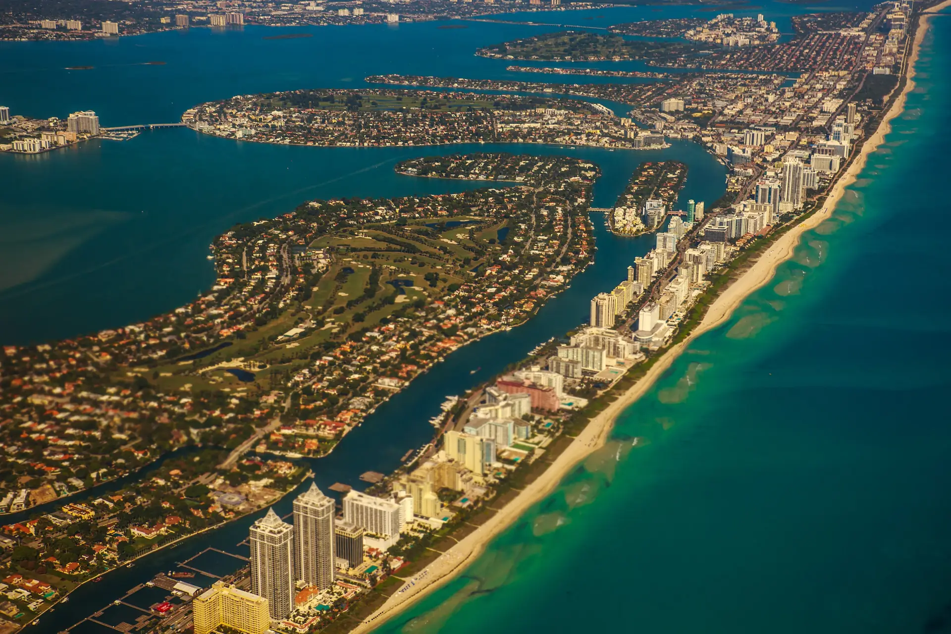 Miami Beach, Indian Creek and the Atlantic surf seen from an aircraft at altitude
