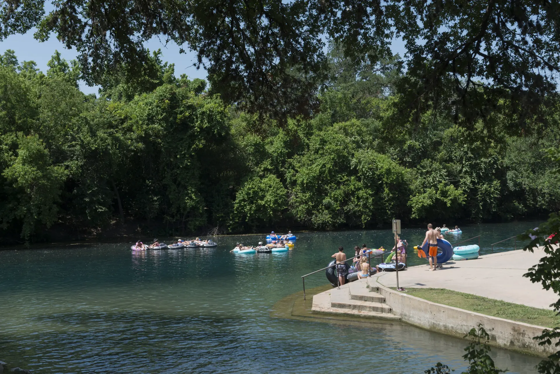 Tubers drifting down the Comal River at Prince Solms Park in New Braunfels