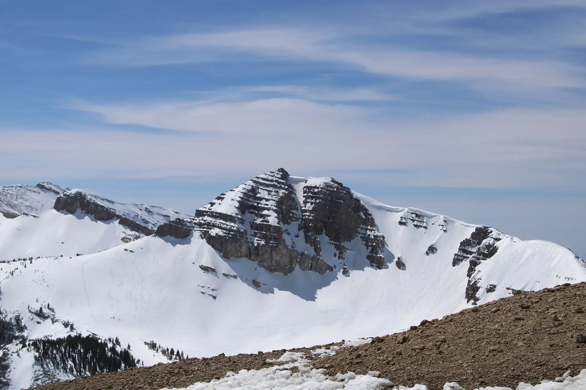 Rock bands and snowfields on the peaks above Teton Village in Jackson Hole