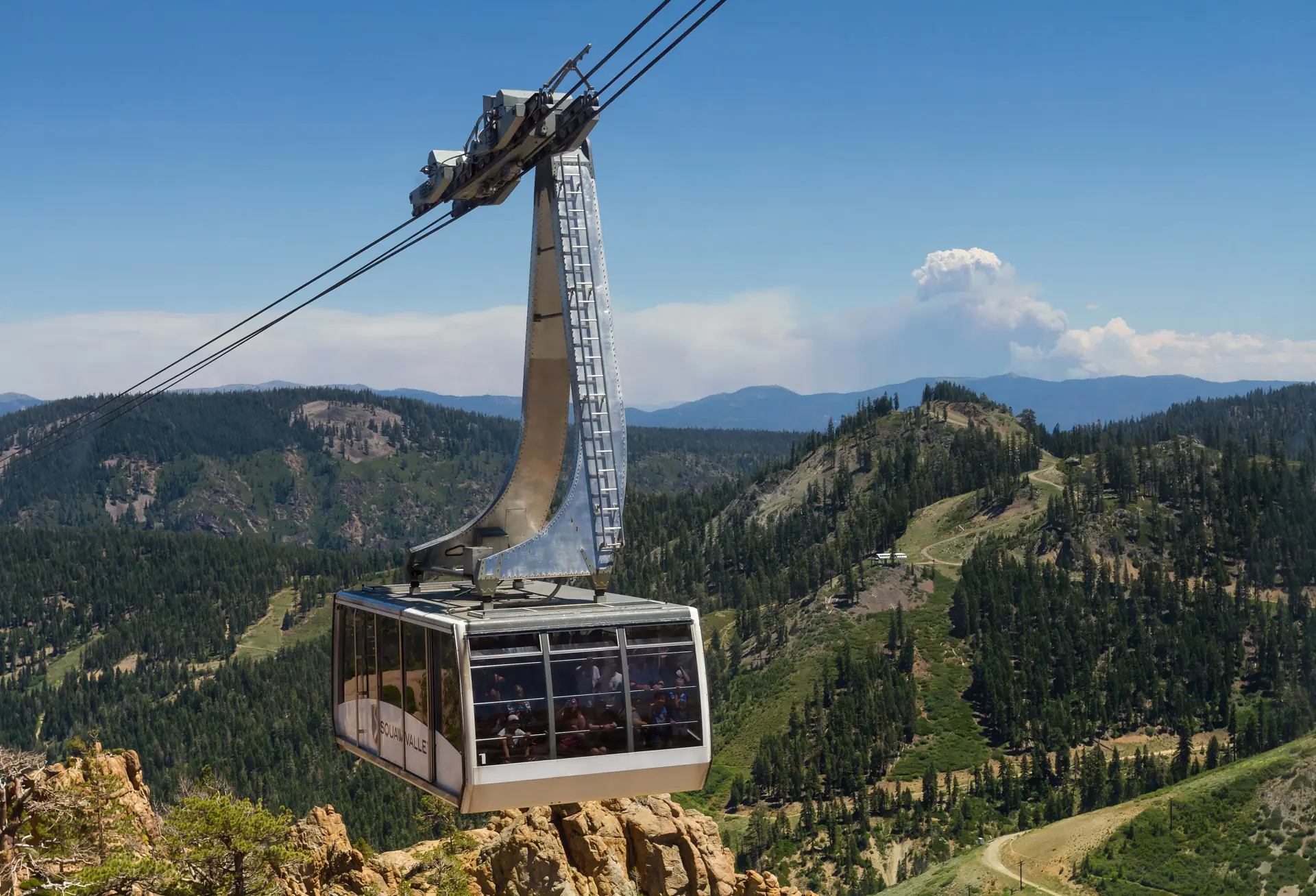The Palisades tram cabin over granite with the Olympic Valley mountains behind