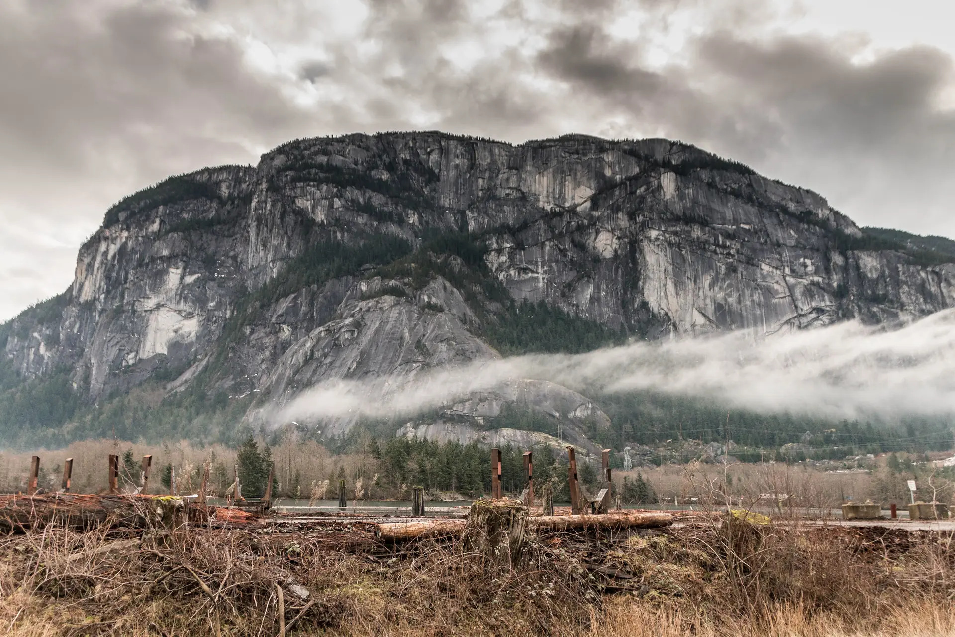 The sheer granite face of the Stawamus Chief above Squamish with cloud along its base